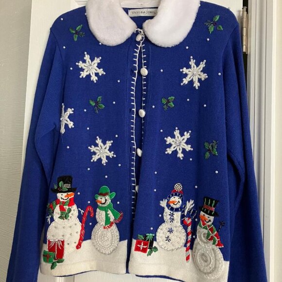 This blue snowmen sweater is so cute on. It is a size medium. - Picture 1 of 3